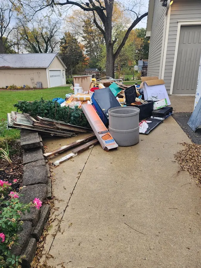 Dumpster being loaded with debris for 30 Yard Dumpster Rental in Mendham